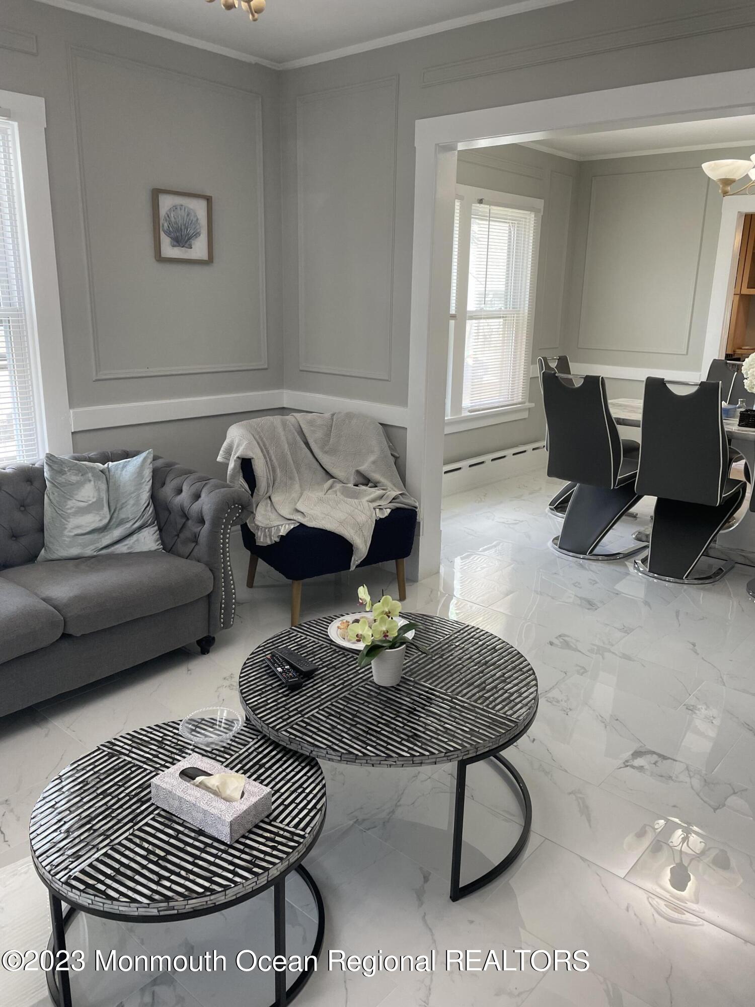 12 Wyckoff Street Deal, NJ 07723 - Photo 3 of 6 a living room with furniture a rug and a table