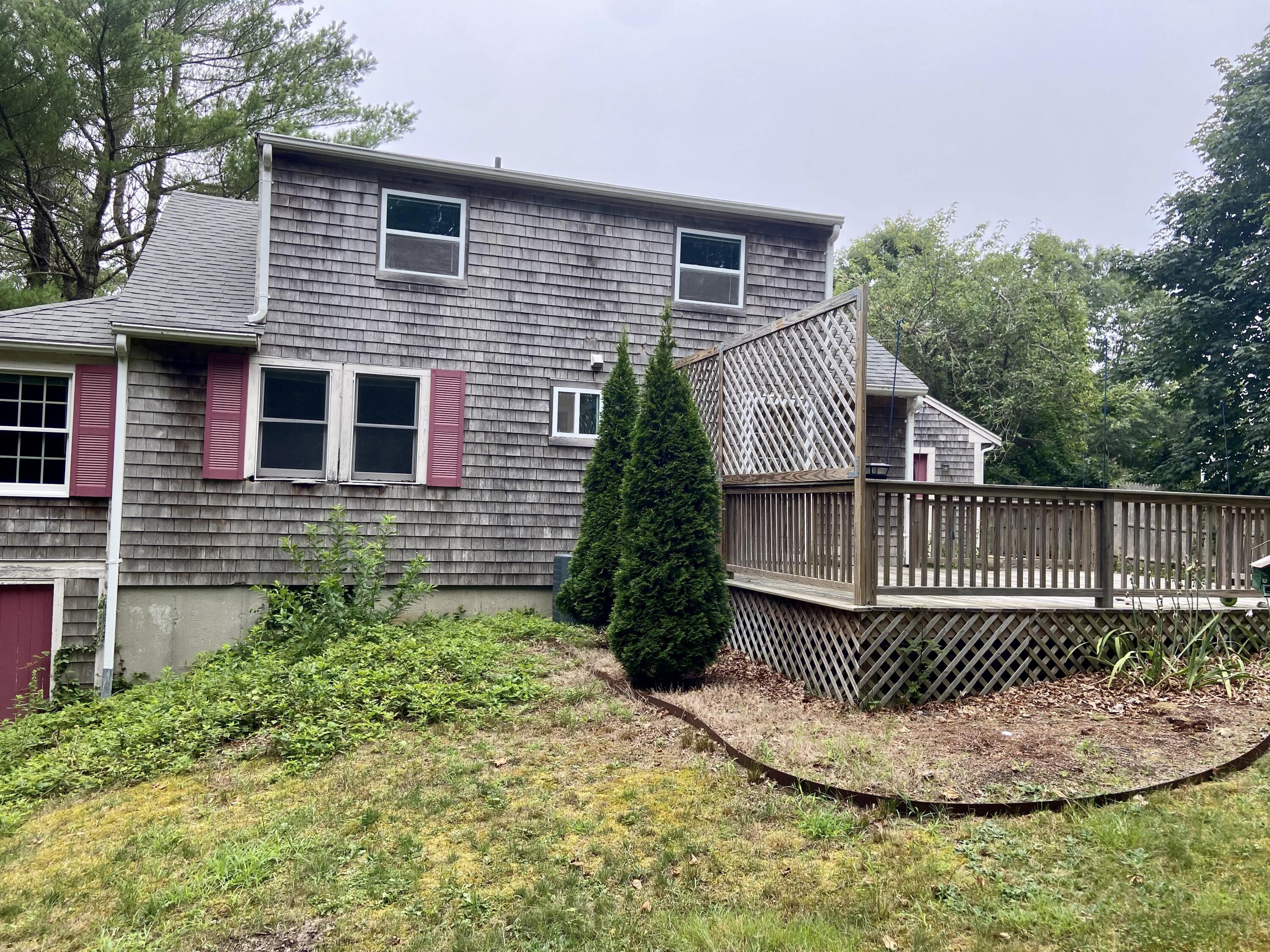 43 Bay Road Harwich, MA 02645 - Photo 20 of 24 a front view of a house with a yard