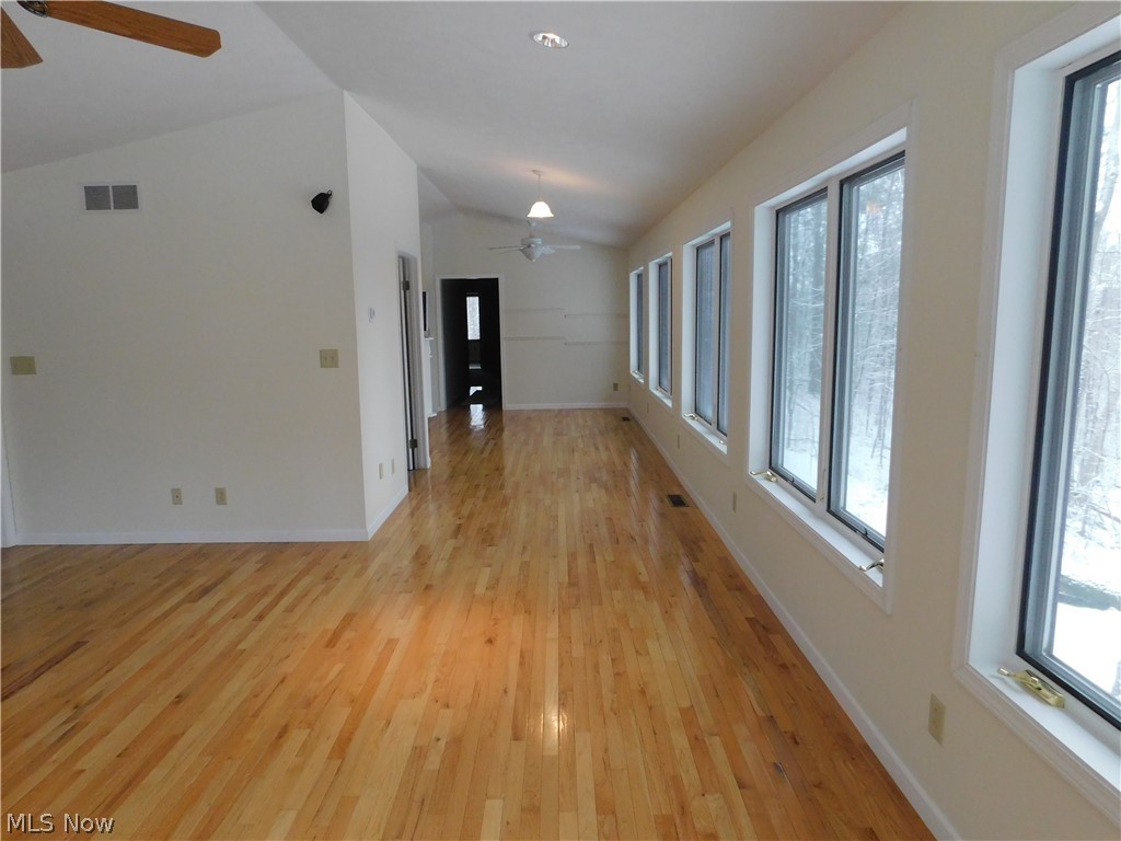 381 Lance Road Davisville, WV 26142 - Photo 10 of 34 View of Sun room from far end area near French Doors. The door on the left leads to Full Bath. The door at the end of the room takes you into the Master Suite area.