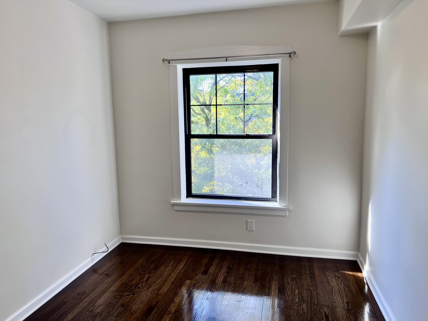 3051 North Racine Avenue, Unit 3F Chicago, IL 60657 - Photo 14 of 21 an empty room with wooden floor and windows