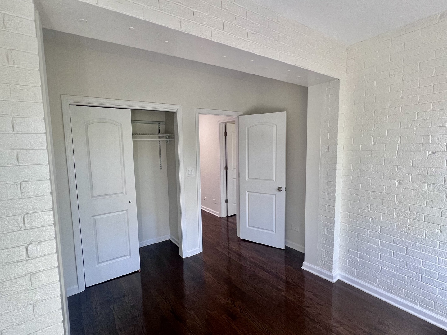 3051 North Racine Avenue, Unit 3F Chicago, IL 60657 - Photo 18 of 21 an empty room with wooden floor and closet