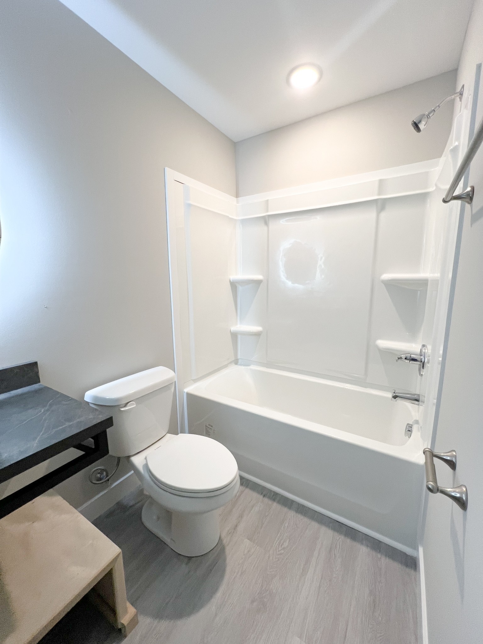 543 Peachers Mill Road, Unit 209 Clarksville, TN 37042 - Photo 11 of 21 a bathroom with a toilet and a bath tub