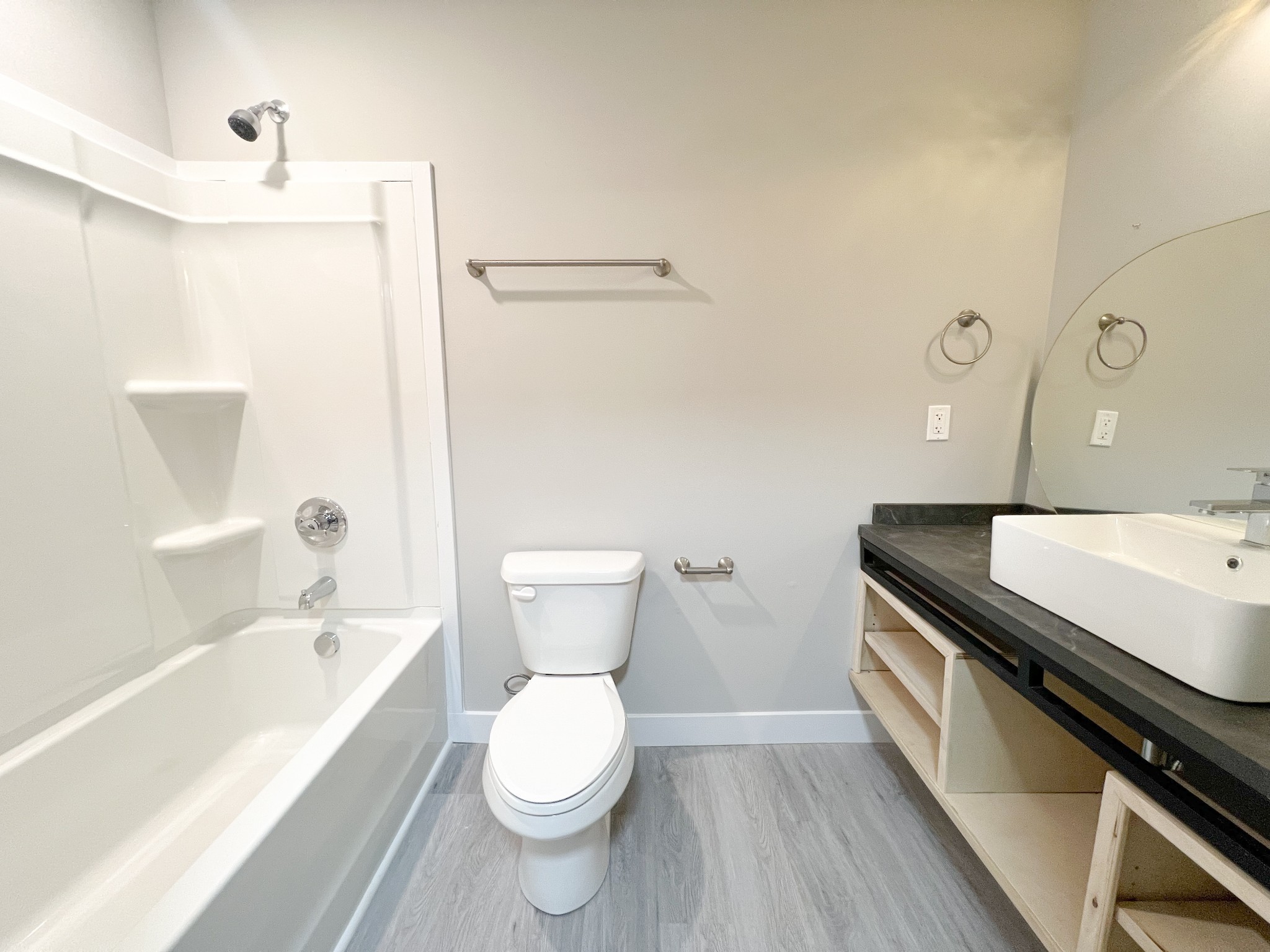 543 Peachers Mill Road, Unit 209 Clarksville, TN 37042 - Photo 18 of 21 a bathroom with a granite countertop sink a toilet and bathtub