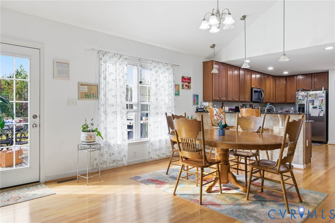 15900 Nobles Road Disputanta, VA 23842 - Photo 8 of 36 Dining room featuring light hardwood floors, a cha