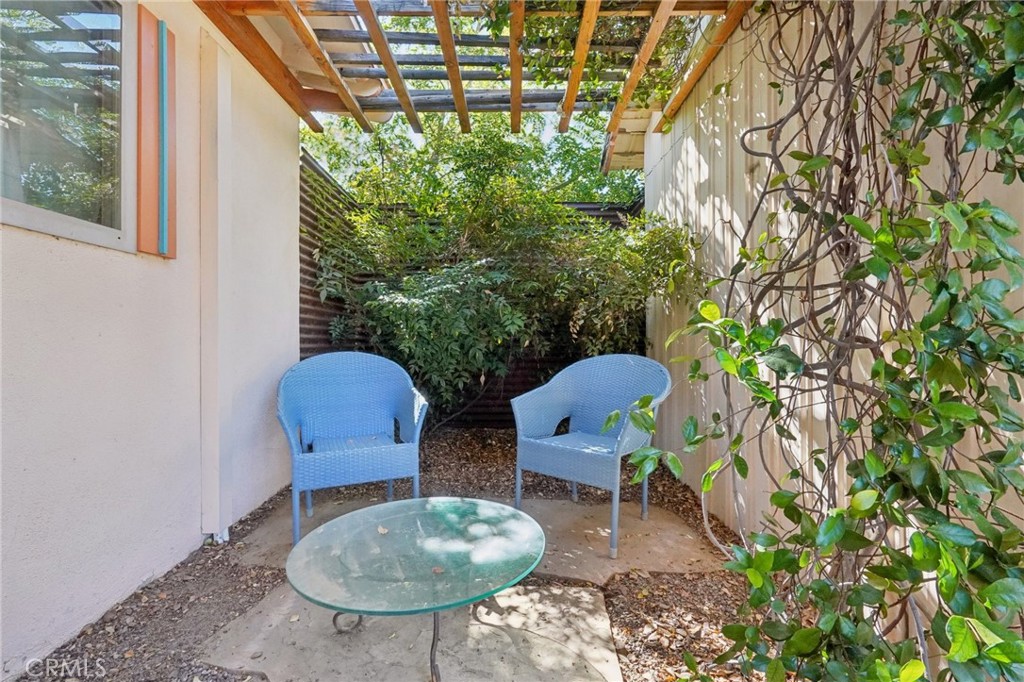 61494 Sunburst Drive Joshua Tree, CA 92252 - Photo 21 of 31 a backyard of a house with table and chairs