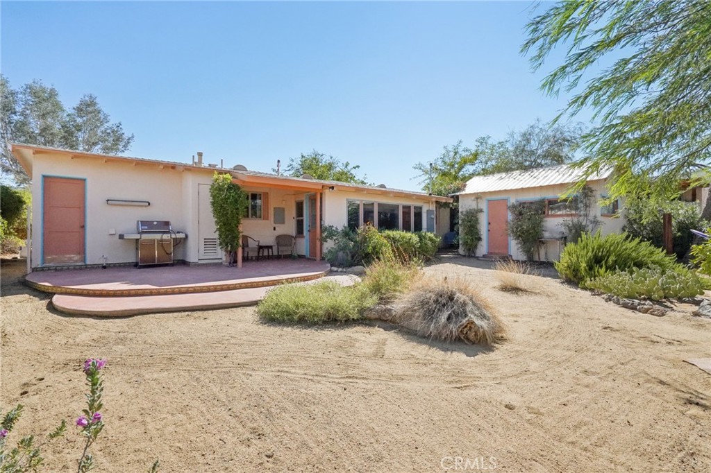 61494 Sunburst Drive Joshua Tree, CA 92252 - Photo 22 of 31 a view of a house with a patio