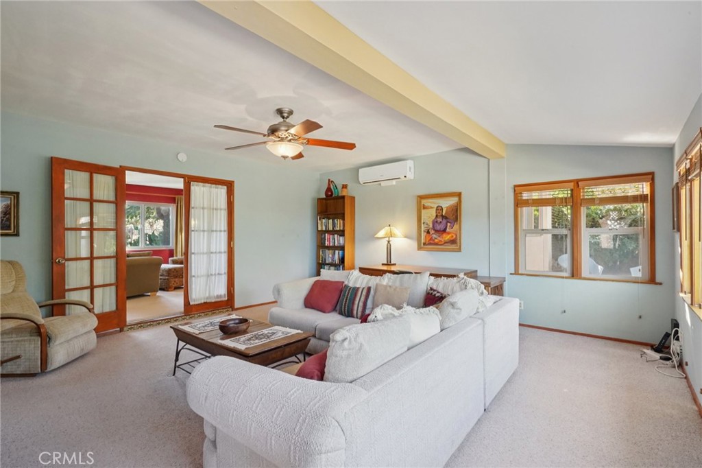 61494 Sunburst Drive Joshua Tree, CA 92252 - Photo 5 of 31 a bedroom with a bed and a large window