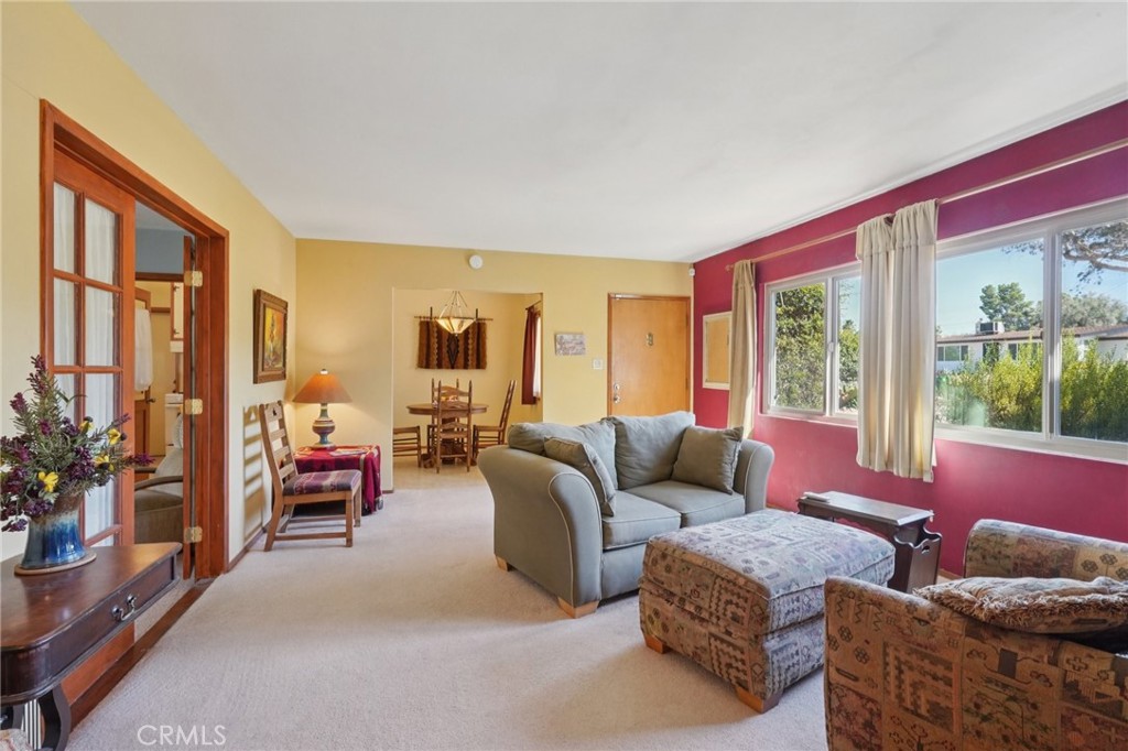 61494 Sunburst Drive Joshua Tree, CA 92252 - Photo 7 of 31 a living room with furniture and a large window