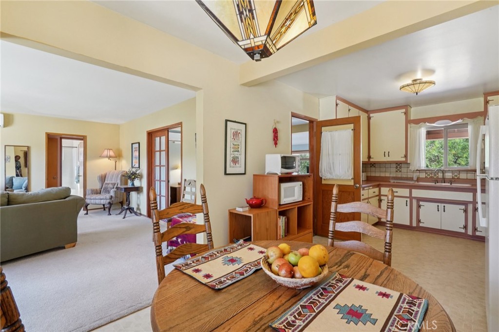 61494 Sunburst Drive Joshua Tree, CA 92252 - Photo 8 of 31 a living room with furniture and wooden floor