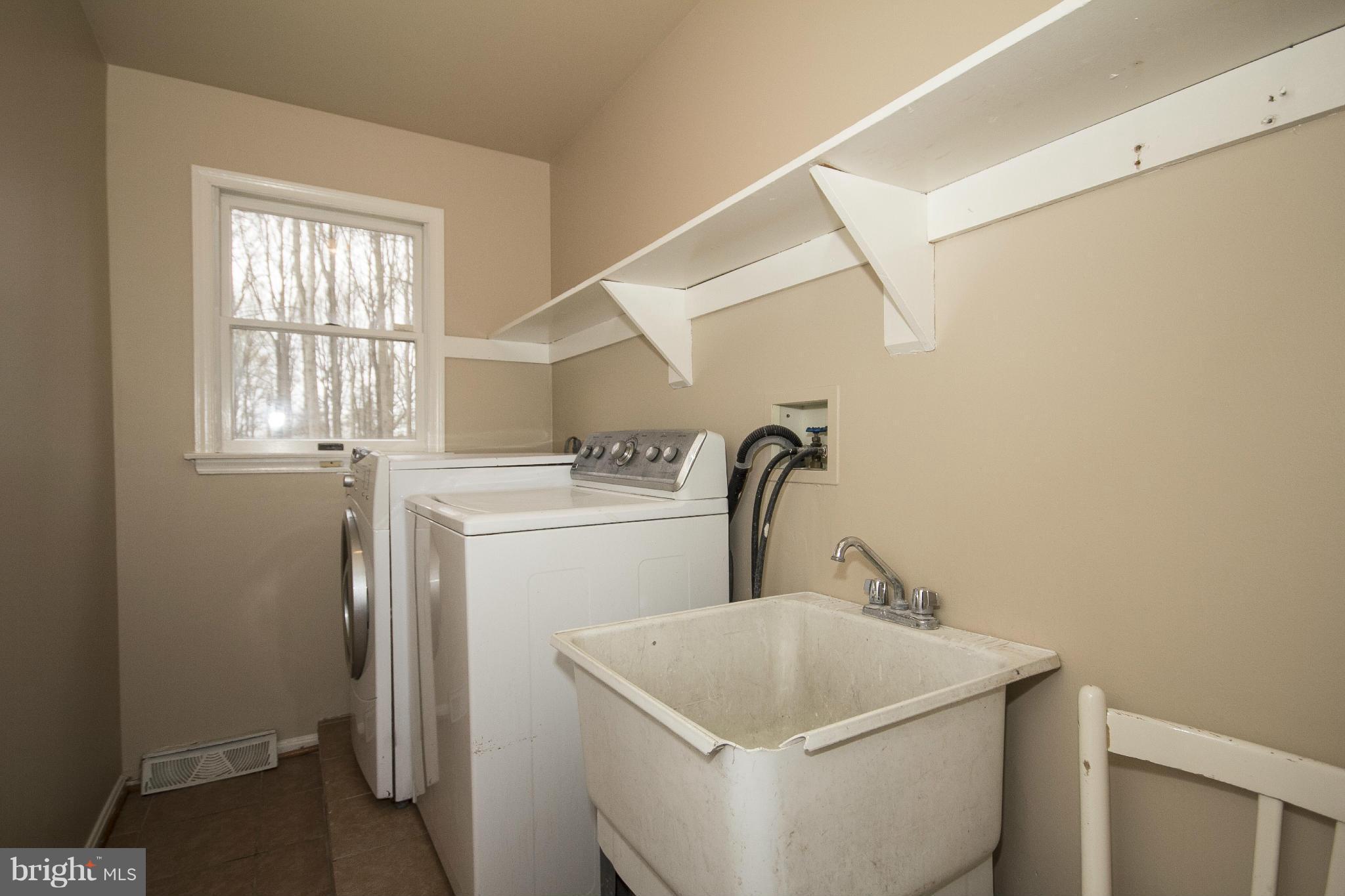 4202 Holbrook Road Randallstown, MD 21133 - Photo 10 of 30 Laundry Room, between Garage and Kitchen