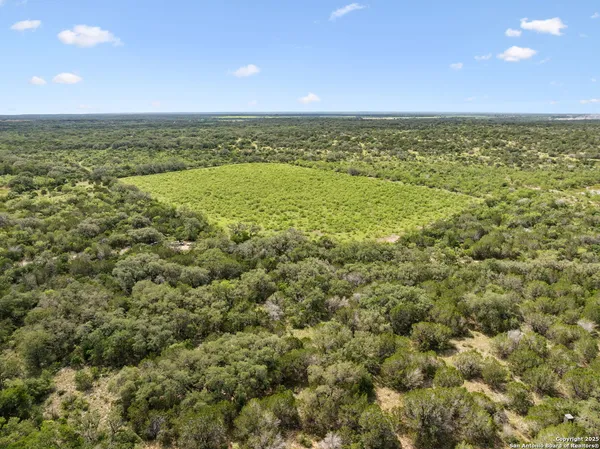 a view of an empty room and mountain view