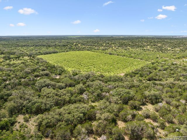 a view of an empty room and mountain view