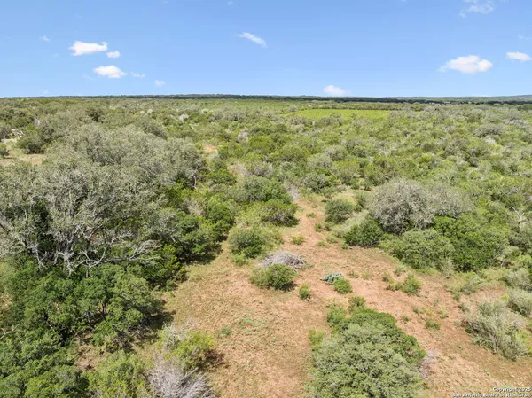 a view of a field with an outdoor space