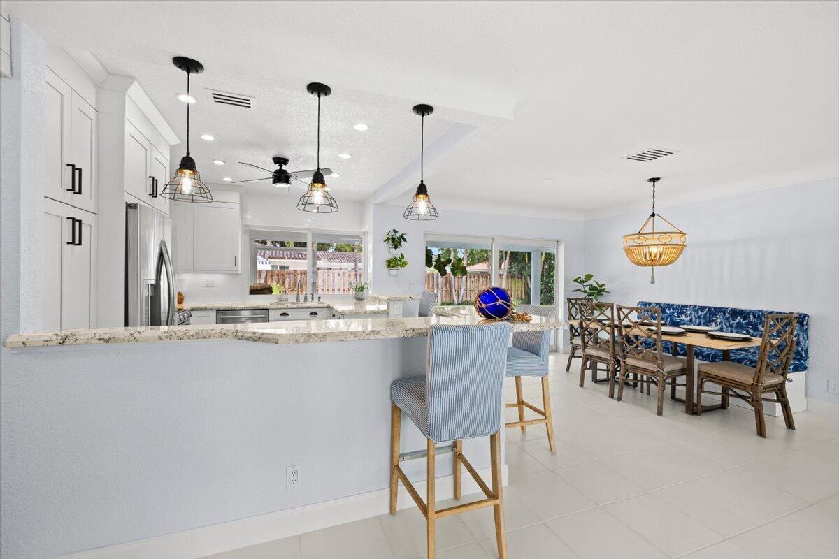 38 Southwest 10th Avenue Boca Raton, FL 33486 - Photo 18 of 44 Kitchen & Dining | Breakfast Bar Seating