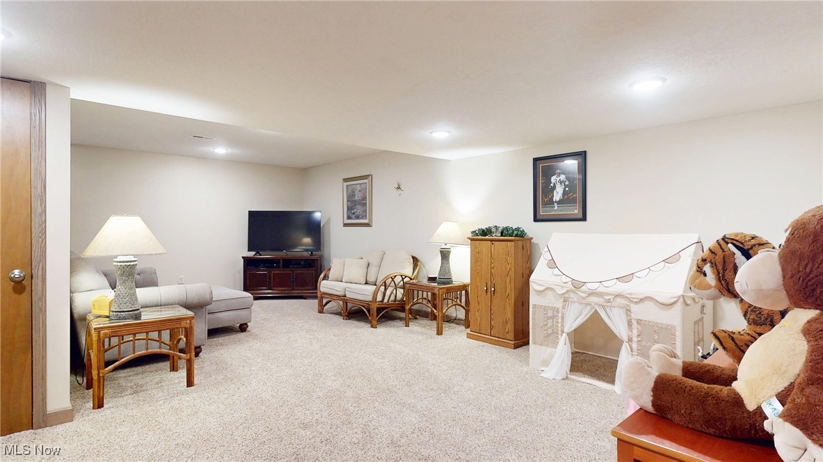 961 Industry Road Atwater, OH 44201 - Photo 29 of 50 Carpeted living room with recessed lighting