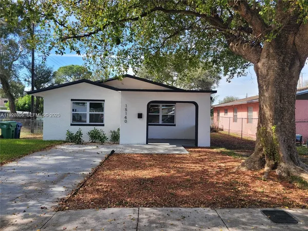 a house with trees in the background