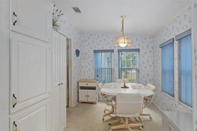 a dining room with furniture window wooden floor