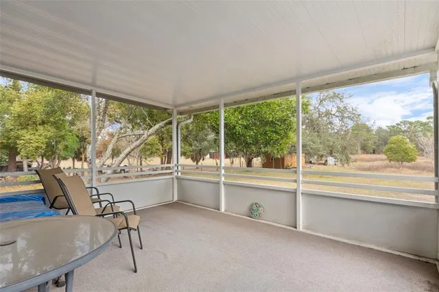 a kitchen with a large window and a table