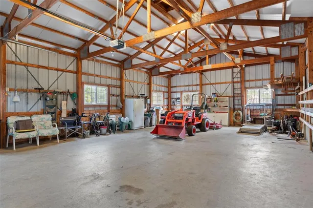 a view of a garage with furniture and a garage