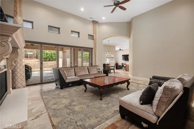 a living room with furniture fireplace and flat screen tv