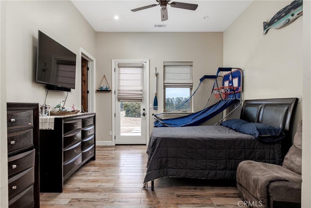 1950 Lemon Ranch Road Arroyo Grande, CA 93420 - Photo 10 of 38 a bedroom with furniture and a flat screen tv