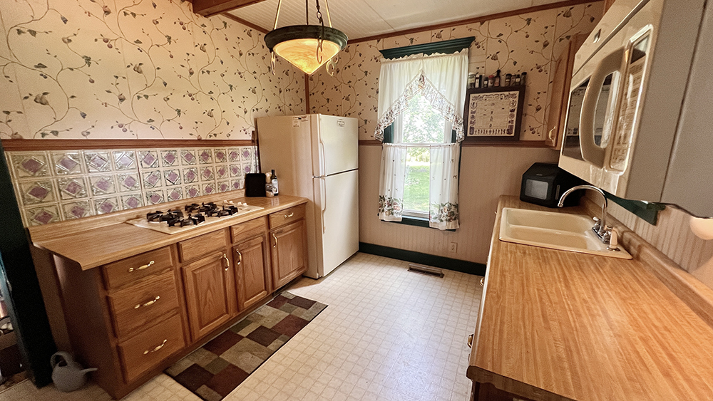14474 Lyndon Road Morrison, IL 61270 - Photo 15 of 31 a kitchen with sink a stove and refrigerator