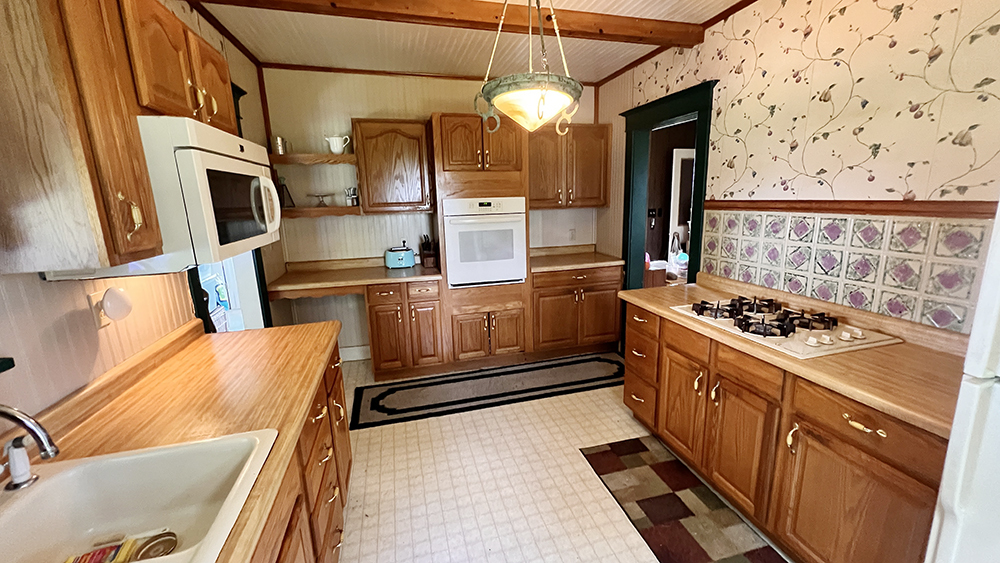 14474 Lyndon Road Morrison, IL 61270 - Photo 16 of 31 a kitchen with stainless steel appliances granite countertop a stove and a refrigerator