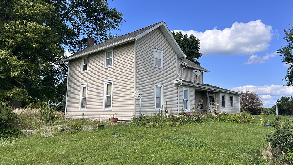 14474 Lyndon Road Morrison, IL 61270 - Photo 2 of 31 a front view of a house with a garden