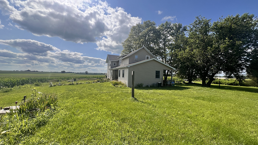 14474 Lyndon Road Morrison, IL 61270 - Photo 5 of 31 a view of a house with a big yard and large tree