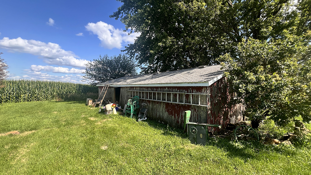 14474 Lyndon Road Morrison, IL 61270 - Photo 8 of 31 a backyard of a house with yard and trampoline