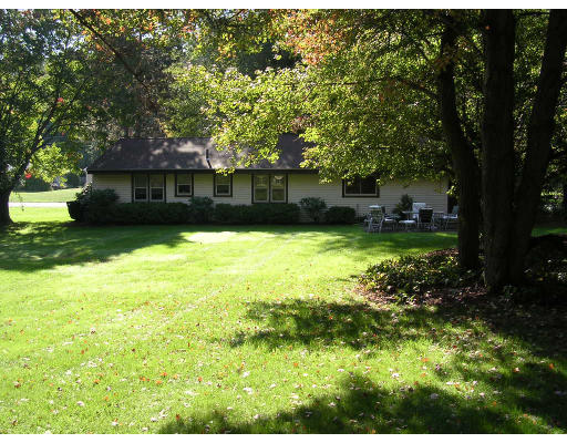 19 Larnis Road Framingham, MA 01701 - Photo 2 of 13 a view of a backyard with a garden and trees
