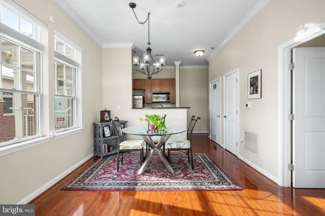 a view of a livingroom with furniture and a chandelier