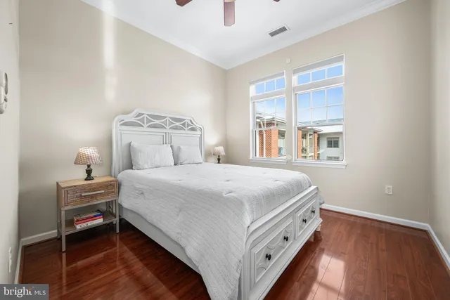 a bedroom with a bed and cabinets