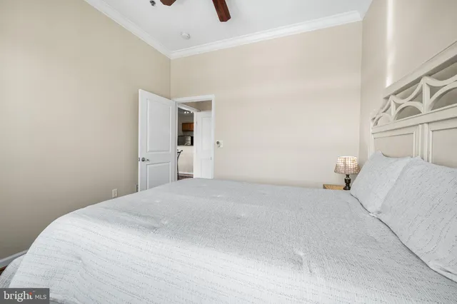a bathroom with a granite countertop sink toilet a mirror and shower