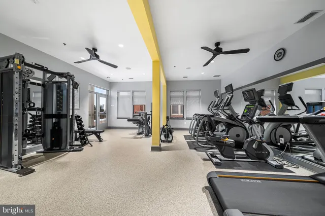 a front view of a building with glass windows and door