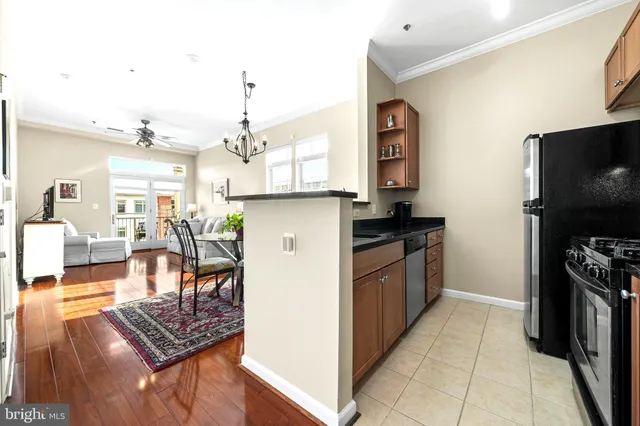 a kitchen with a sink stove and refrigerator