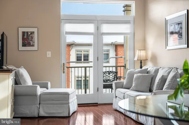 a view of a dining room with furniture and a potted plant