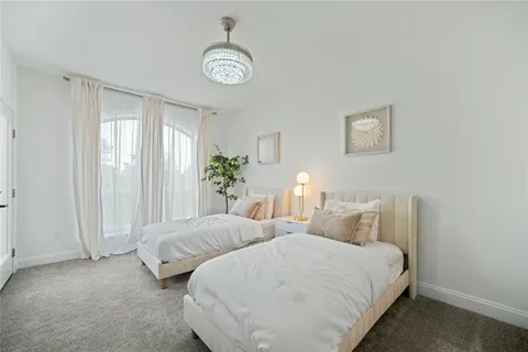 a bedroom with bed and a window