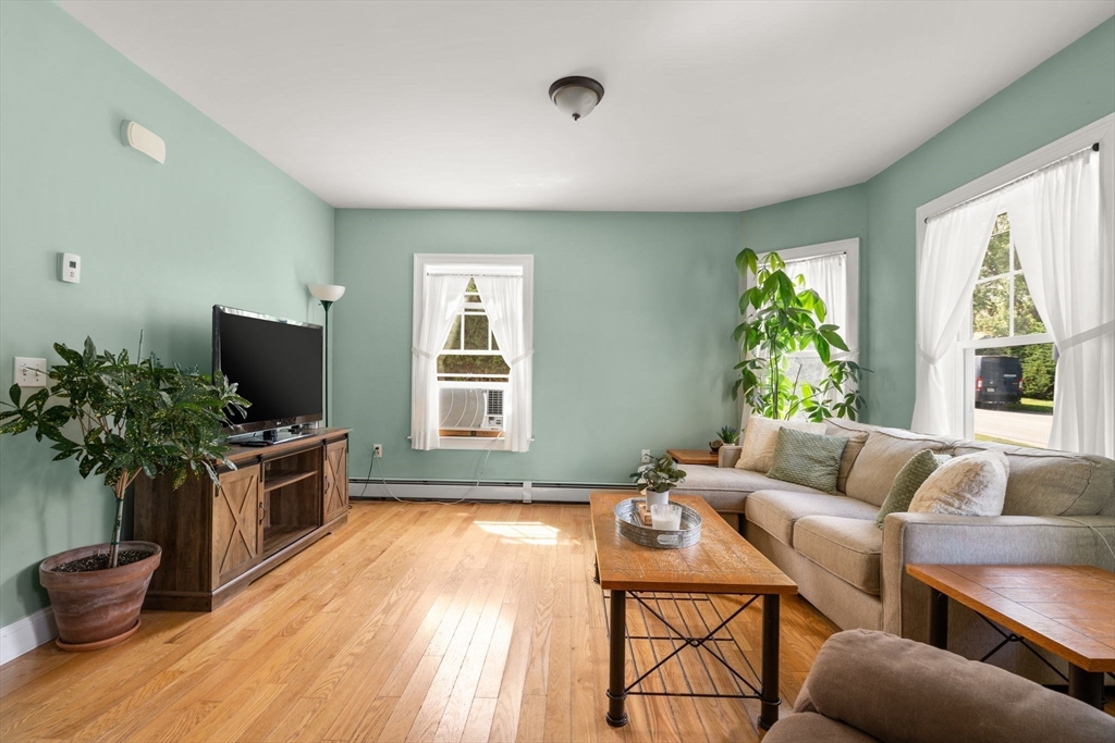 109 Read Street Somerset, MA 02726 - Photo 11 of 42 a living room with furniture and a flat screen tv