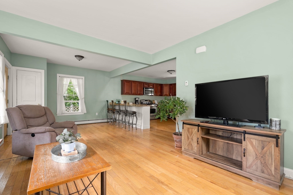 109 Read Street Somerset, MA 02726 - Photo 13 of 42 a living room with furniture and a flat screen tv