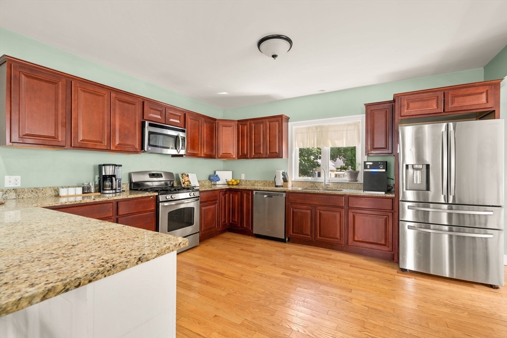 109 Read Street Somerset, MA 02726 - Photo 16 of 42 a large kitchen with stainless steel appliances granite countertop a refrigerator sink and cabinets