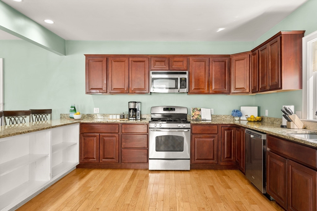 109 Read Street Somerset, MA 02726 - Photo 17 of 42 a kitchen with stainless steel appliances granite countertop a stove sink and cabinets