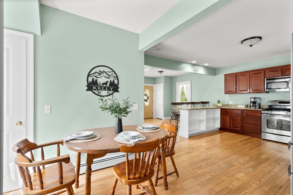 109 Read Street Somerset, MA 02726 - Photo 19 of 42 a view of a dining room with furniture and a kitchen