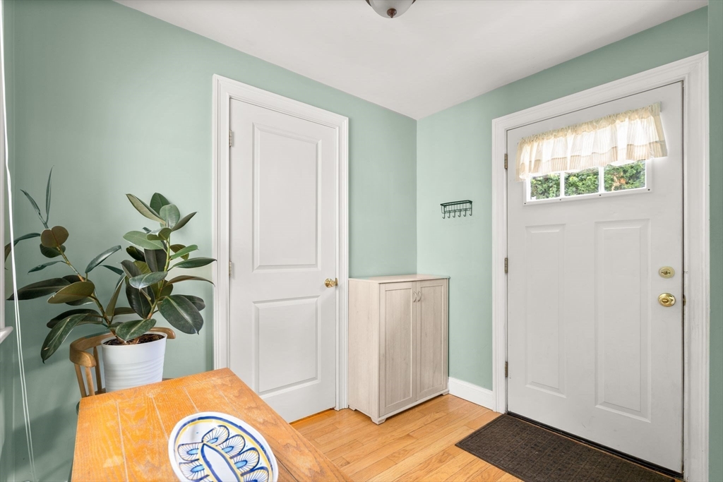 109 Read Street Somerset, MA 02726 - Photo 22 of 42 a bedroom with a bed and a potted plant