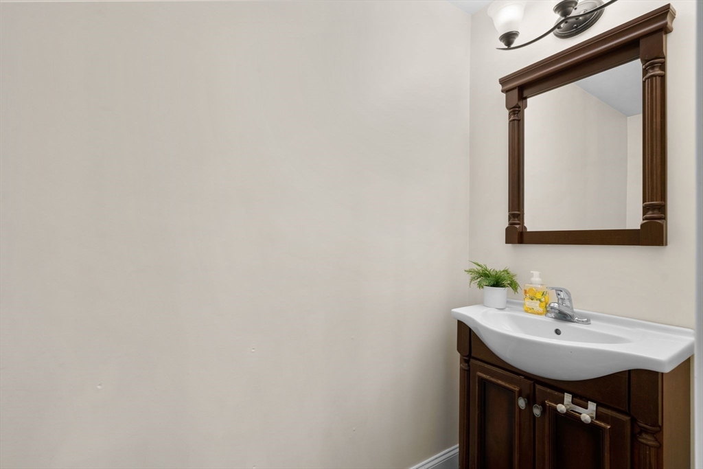 109 Read Street Somerset, MA 02726 - Photo 23 of 42 a bathroom with a sink a mirror and vanity