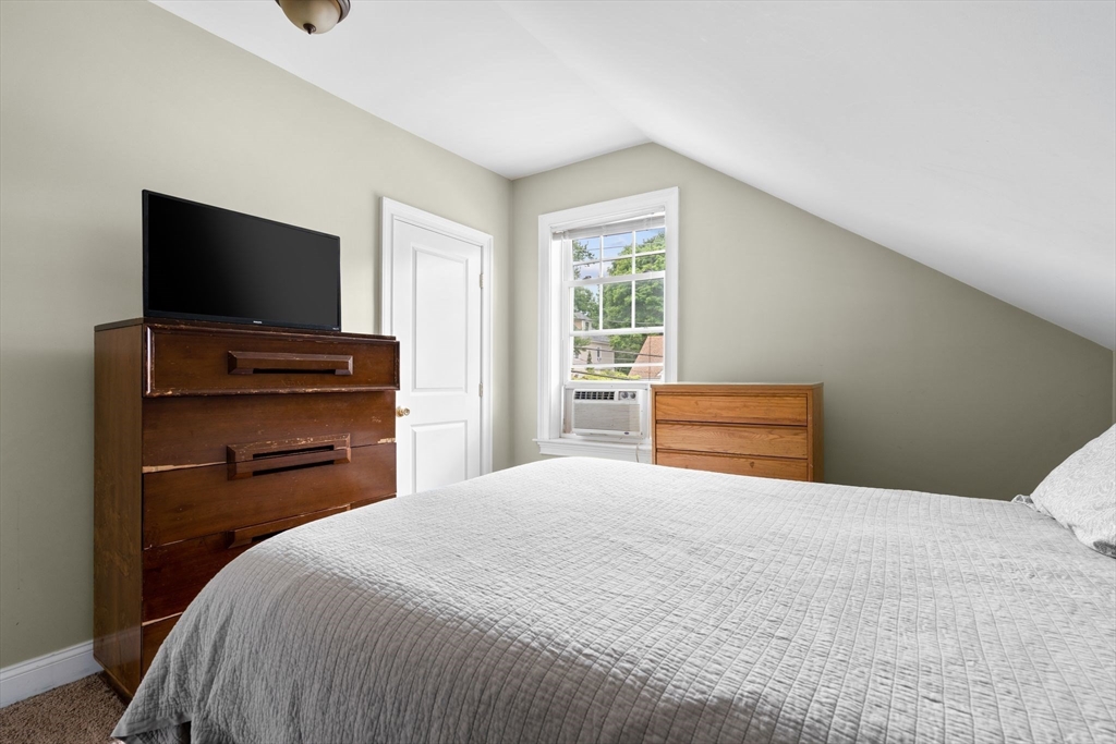 109 Read Street Somerset, MA 02726 - Photo 29 of 42 a bedroom with a bed and a flat screen tv