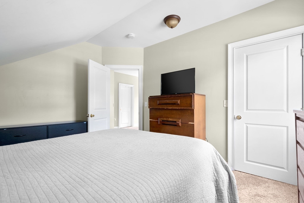 109 Read Street Somerset, MA 02726 - Photo 30 of 42 a bedroom with a bed and a flat screen tv
