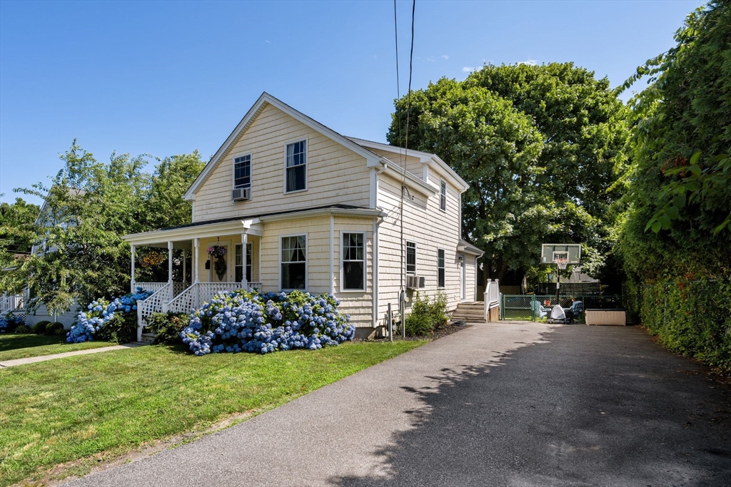 109 Read Street Somerset, MA 02726 - Photo 3 of 42 a front view of a house with garden