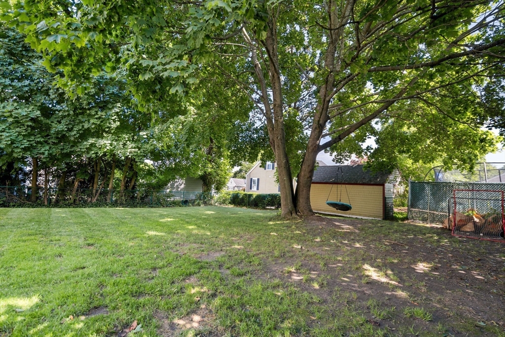 109 Read Street Somerset, MA 02726 - Photo 39 of 42 a backyard of a house with table and chairs