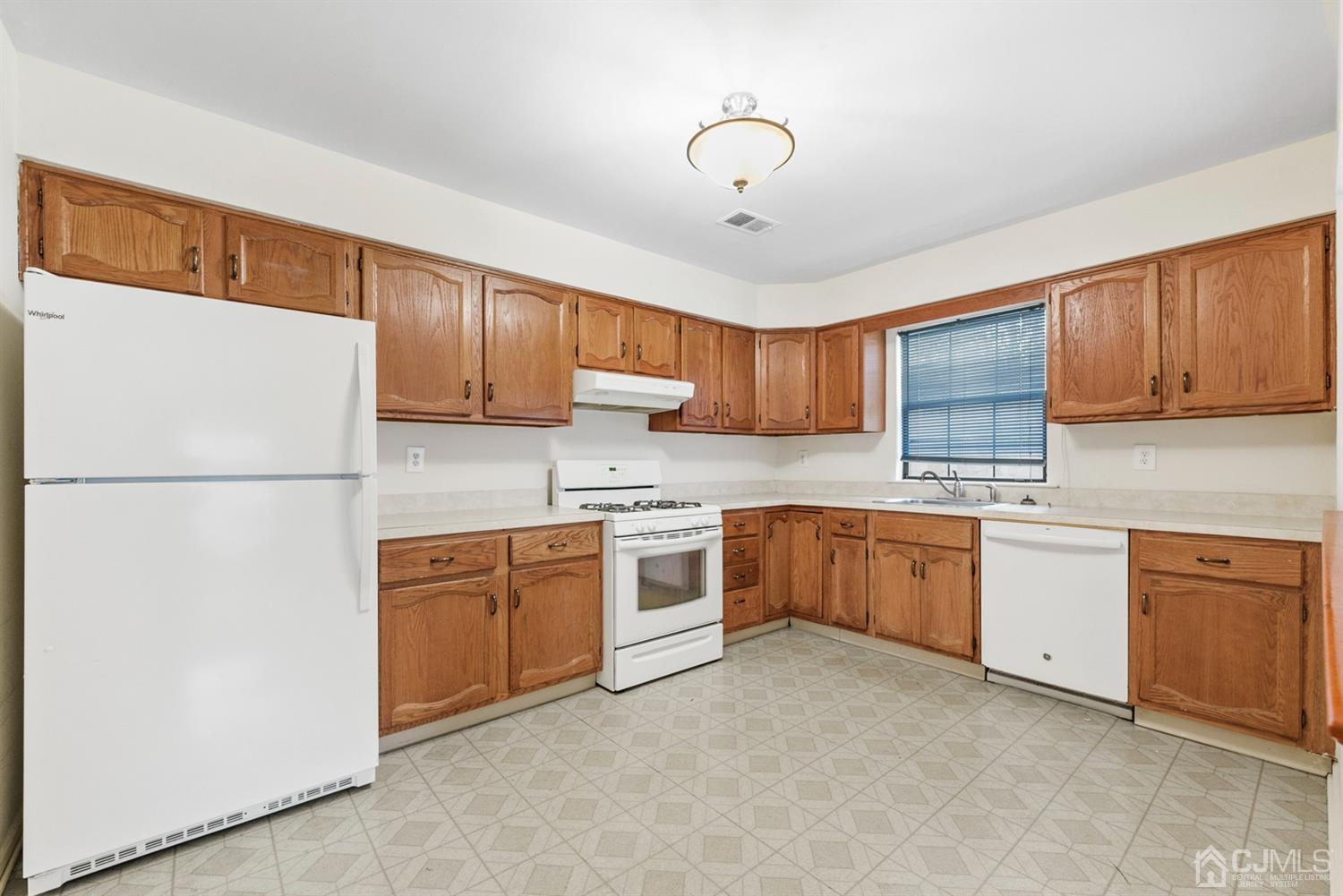 3708 Cricket Circle Edison, NJ 08820 - Photo 11 of 40 a kitchen with stainless steel appliances granite countertop a refrigerator a sink dishwasher a stove top oven a refrigerator with cabinets and wooden floor